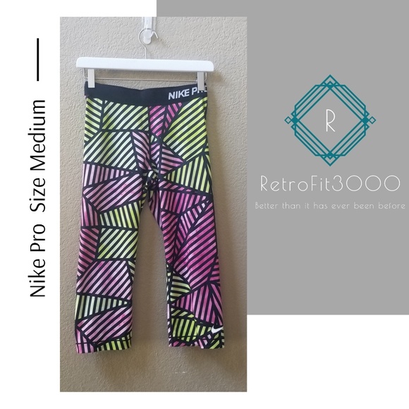 Nike Pants - Nike Pro pink and lime green capris pants size med